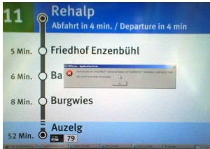 Image of the new station information system in some of Zurich\'s tramways with a Windows GPF on top of the display